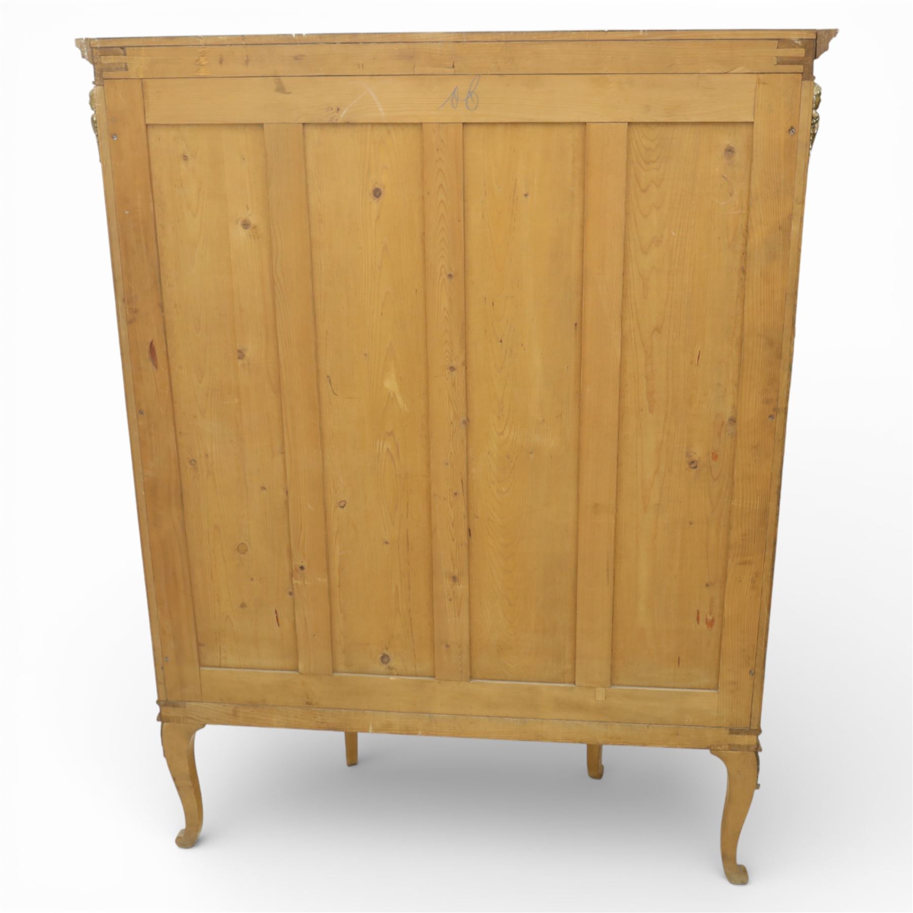 Edwardian satin walnut display cabinet, bowed oval form with moulded and dentil cornice over glazed panels, enclosing a laurel wreath damask interior with adjustable glass shelves, the frame applied with gilt metal bead mouldings and mask mounts, enclosing a shelved interior, raised on cabriole supports with moulded feet
