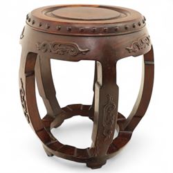 Pair of early 20th century Oriental hardwood barrel seats, of drum form with shaped apron and pierced panels, carved with stylised scrollwork and studded detail to the top