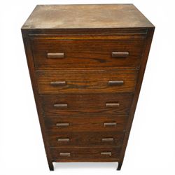 Edwardian tall oak chest fitted with six long drawers, on stile supports