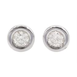 Pair of 14ct white gold bezel set round brilliant cut diamond stud earrings, total diamond weight approx 0.30 carat