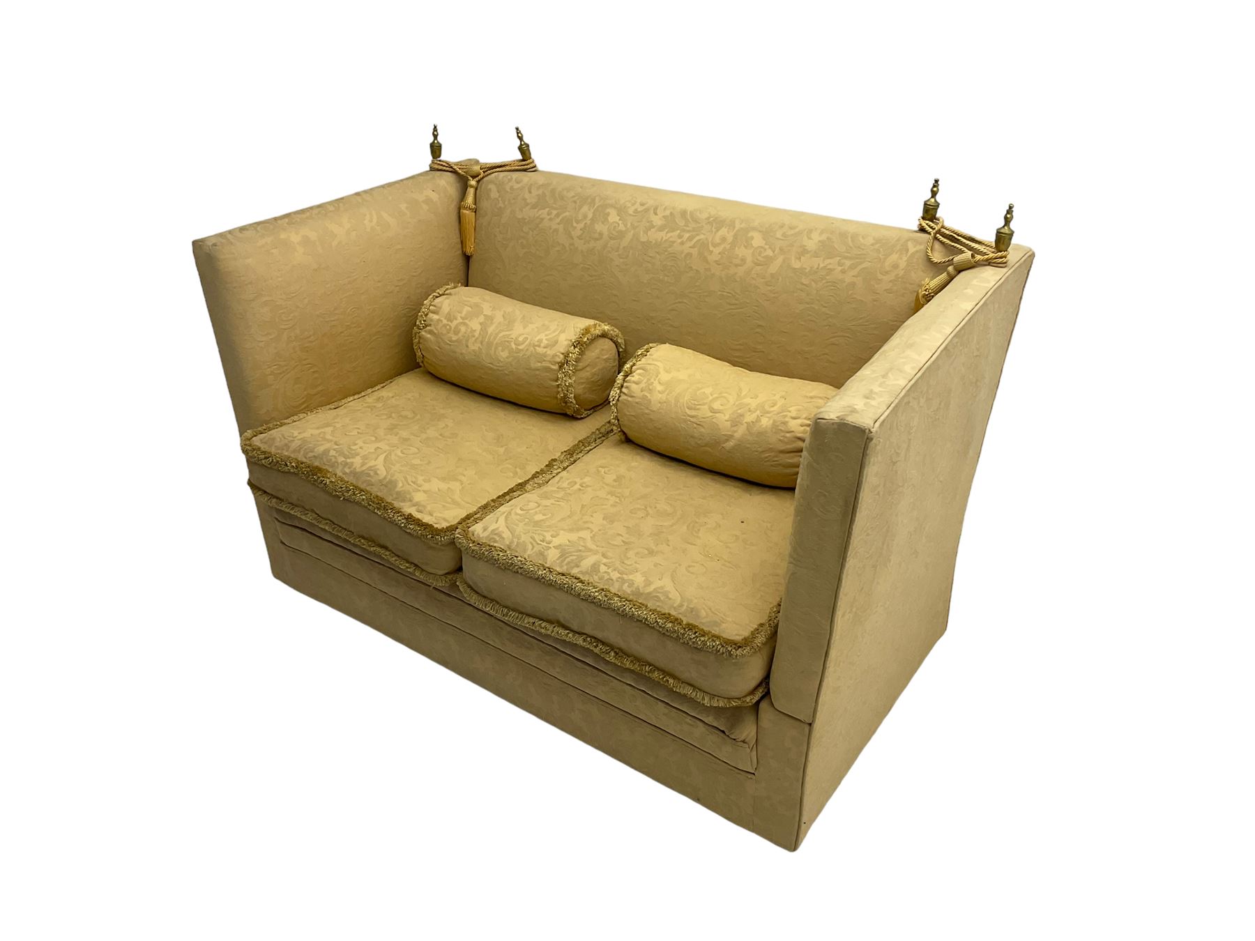 Edwardian knole design drop-arm two seat sofa, upholstered in yellow damask fabric with sprung back and seat and matching bolster cushions