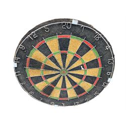 Dart board in wooden cabinet