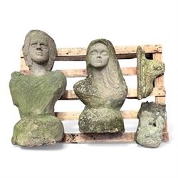 Two large cast stone figures with small lion and face stone pieces