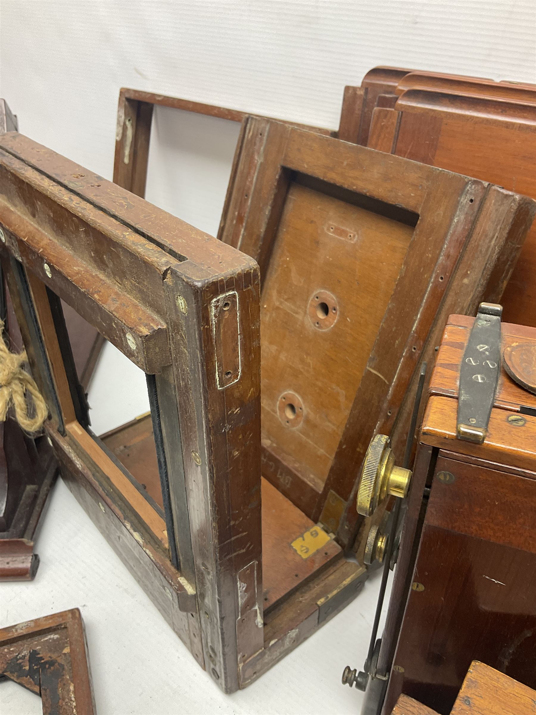 Collation of folding plate cameras of various sizes folding plate in mahogany and lacquered brass, together with camera plates and slides
By vendors repute some slide are from the Gandolfi workshop
