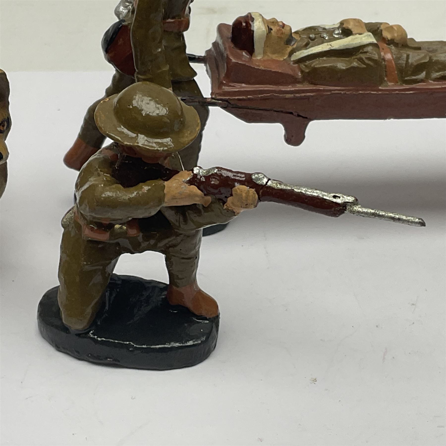 Eight Elastolin British soldiers and wartime figures, including nurse, injured soldier on stretcher, soldier with dog, etc, tallest 11cm