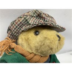 Lakeland Bears teddy bear, titled 'Walkright', dressed as a hiker in green corduroy duffle coat over fair isle jumper, trousers and knit socks, complete with leather clogs with wood soles, walkers thumb stick, knitted scarf, flat cap and rucksack housing original tag and map, H50cm