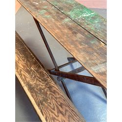 Early 20th century pine trestle table, the hinged top on a folding 'X' frame base. (H79cm, 181cm x 55cm) together with a folding pine trestle bench (L181cm) - COLLECTION BY APPOINTMENT FROM: The White House, Thirsk Road, Easingwold, York, YO61 3NF - CALL 01723 507111 TO ARRANGE