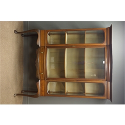  Edwardian inlaid mahogany display cabinet, projecting cornice, glazed bow front door enclosing three shelves, single drawer to carved apron, cabriole supports, W122cm, H177cm, D45cm  
