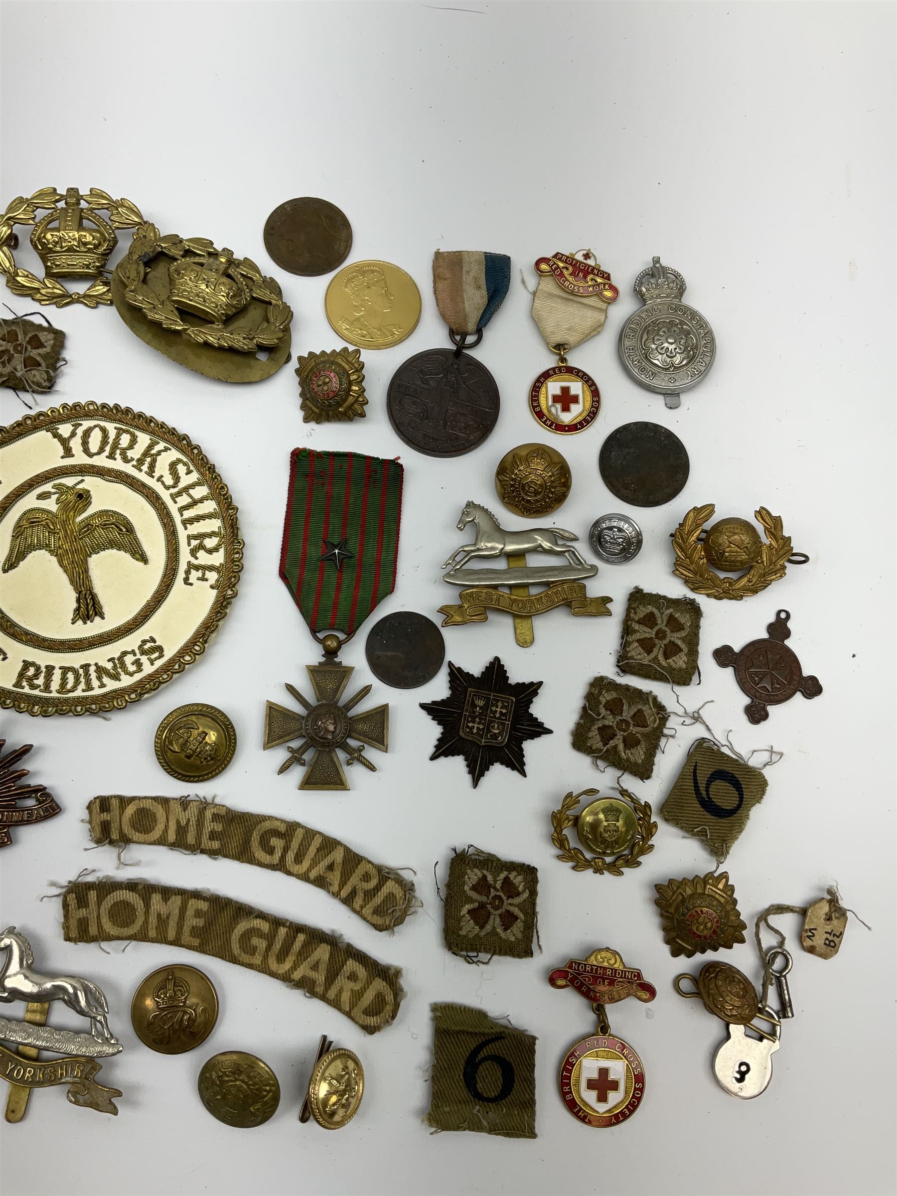 WW1 French Croix de Guerre medal dated 1914-18 with star on ribbon; Yorkshire North & East Ridings Provincial Grand Deacon masonic silver and enamel pendant and blazer badge; helmet plate, cap badges and assorted military buttons including boxed Royal Artillery set of waistcoat buttons etc
