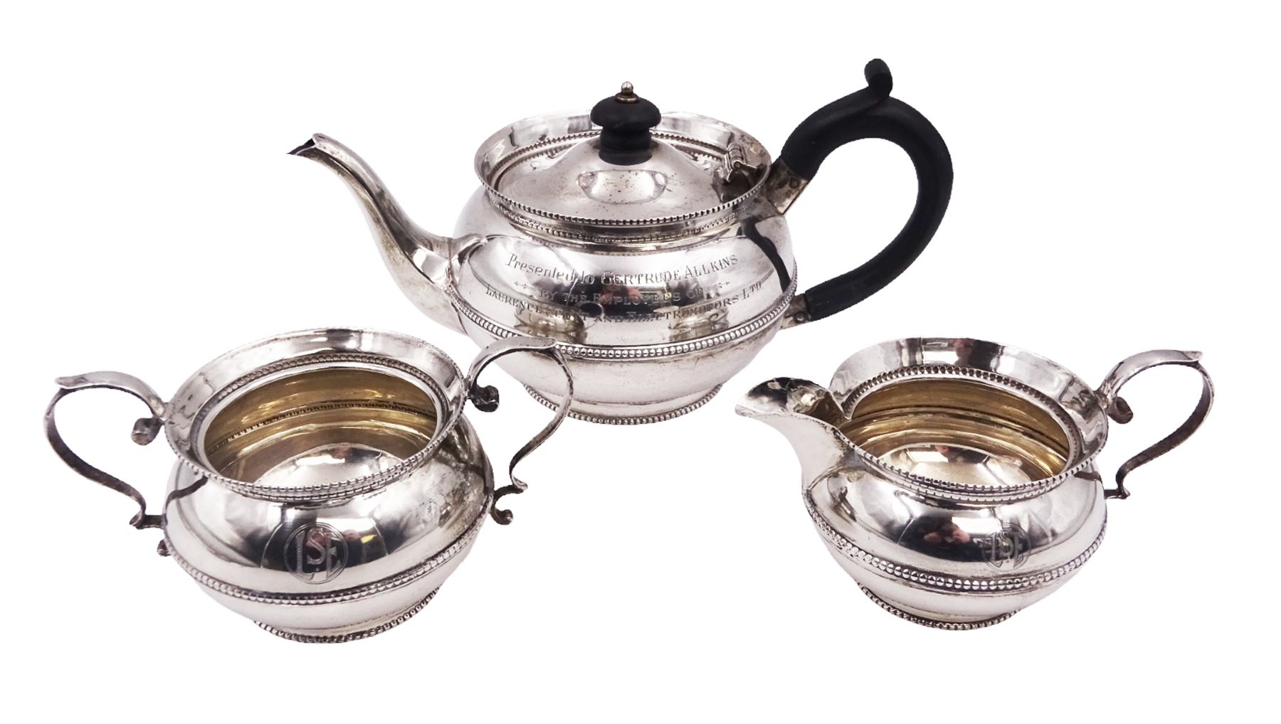 1920s silver three piece bachelors tea service, comprising teapot, with Bakelite handle and finial, milk jug and twin handled open sucrier, each with beaded rim and girdle, all with presentation engravings to body, hallmarked Charles Boyton & Son Ltd, London 1926, teapot H11cm