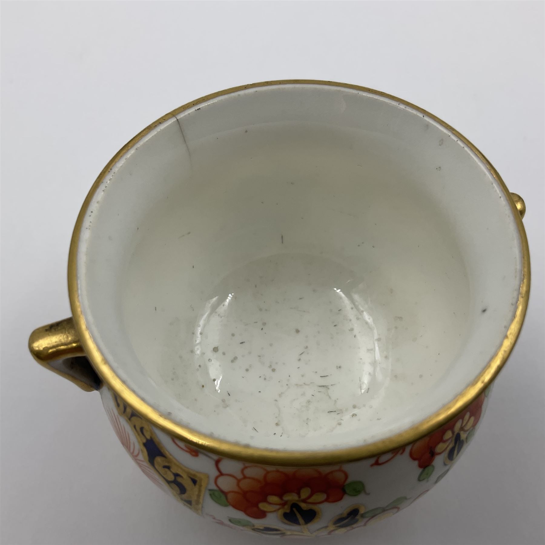 Group of Crown Derby and Royal Crown Derby Imari pattern miniatures, including mid 19th century Stevenson and Hancock cauldron, with painted mark beneath, H5.5cm, a near pair of early Royal Crown Derby scuttles, decorated in the 6299 pattern, each with printed and painted marks beneath including illustration date codes for 1913 and 1922, tallest 6.5cm, and a further early 20th century Royal Crown Derby scuttle, decorated in the 6299 pattern, with printed and painted marks beneath including illustration date code for 1922, H5.5cm, (4)
