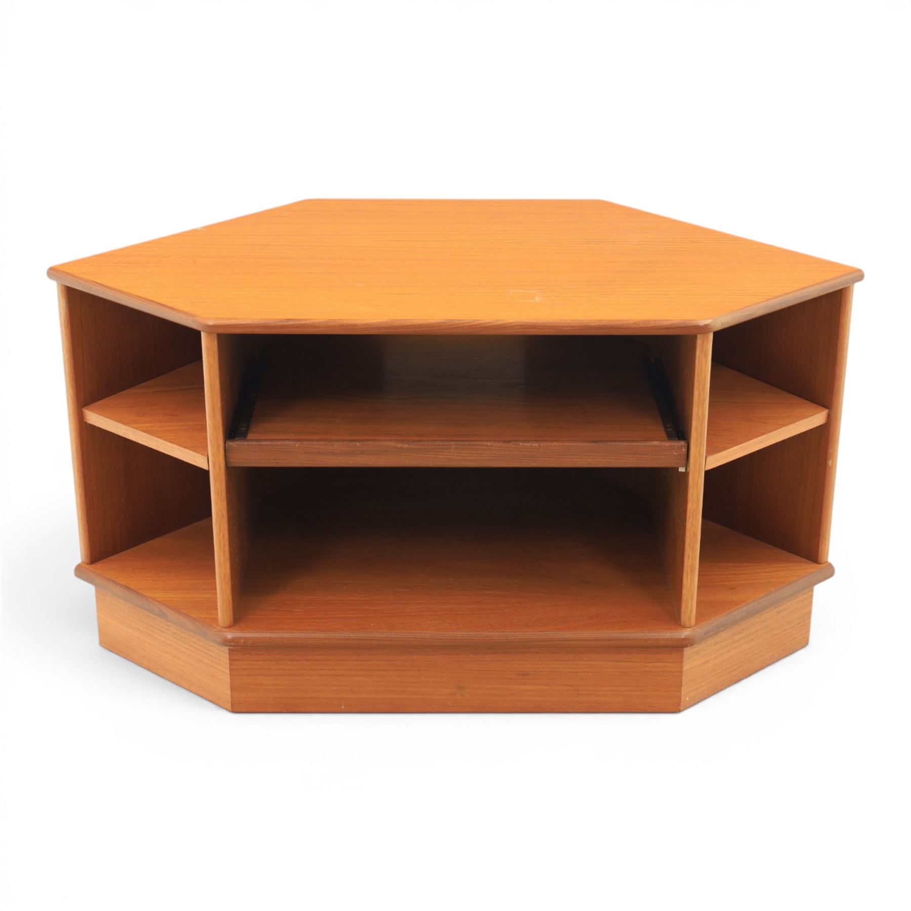 G-Plan - teak corner media unit, shaped top above a sliding central shelf above an open recess, flanked by further shelves, raised on a plinth base with a rear aperture for wires