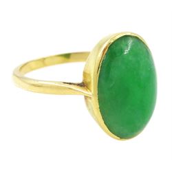 Early - mid 20th century gold jade ring, bezel set with a single oval cabochon jade of approx 4.10 carat, stamped 18ct