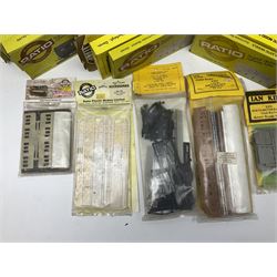 '00' gauge trackside accessories - twenty-six Ratio Plastic Model kits of passenger coaches, wagons, signals, water tower, signal box, station building and platform canopy; and four Ian Kirk passenger coach/wagon kits etc; all boxed or packaged