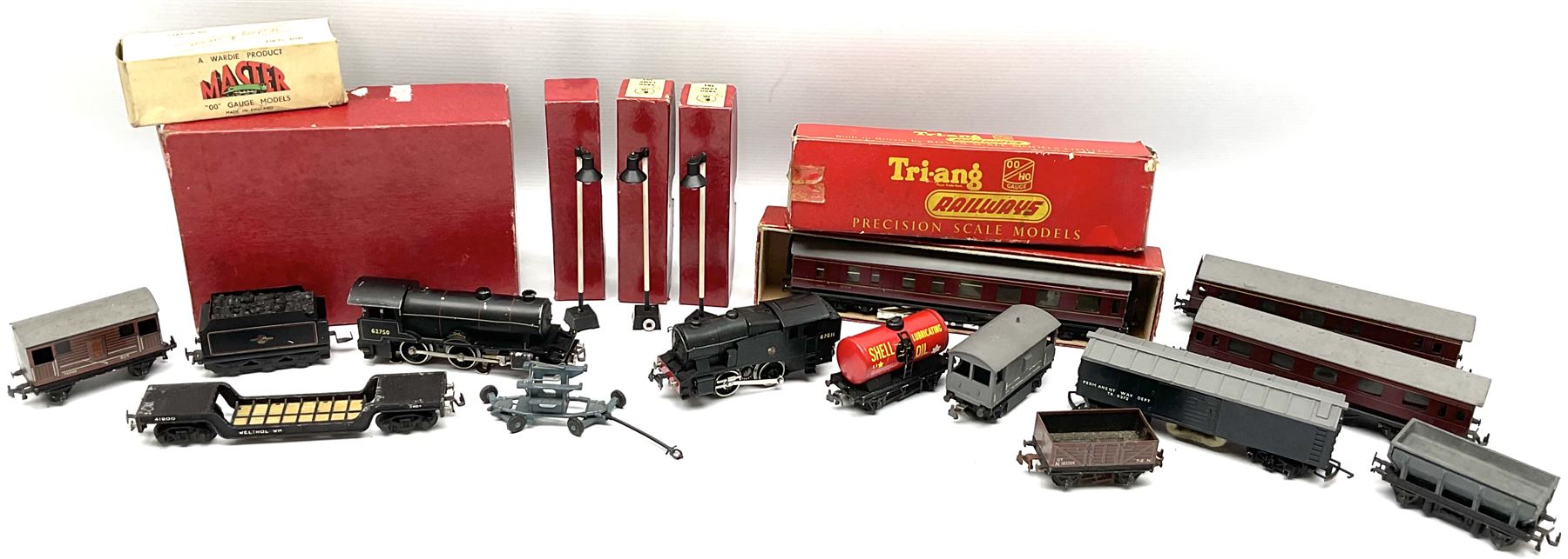 Trix Twin Railway - Hunt Class 4-4-0 locomotive and tender 'Pytchley' No.62750, boxed; 0-4-0 tank locomotive with plastic body No.67611; three passenger coaches (one boxed); six goods wagons; three boxed Yard Lamps etc; and Tri-ang Track Cleaning Car, boxed