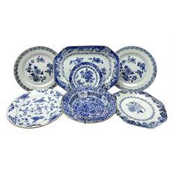 Group of late 18th/early 19th century Chinese export blue and white porcelain, comprising platter of canted form, dish, and five plates, each with foliate decoration, a number of examples with foliate, spearhead and trellis borders, platter W31cm, pair of plates D22.5cm, small plate D16.5cm