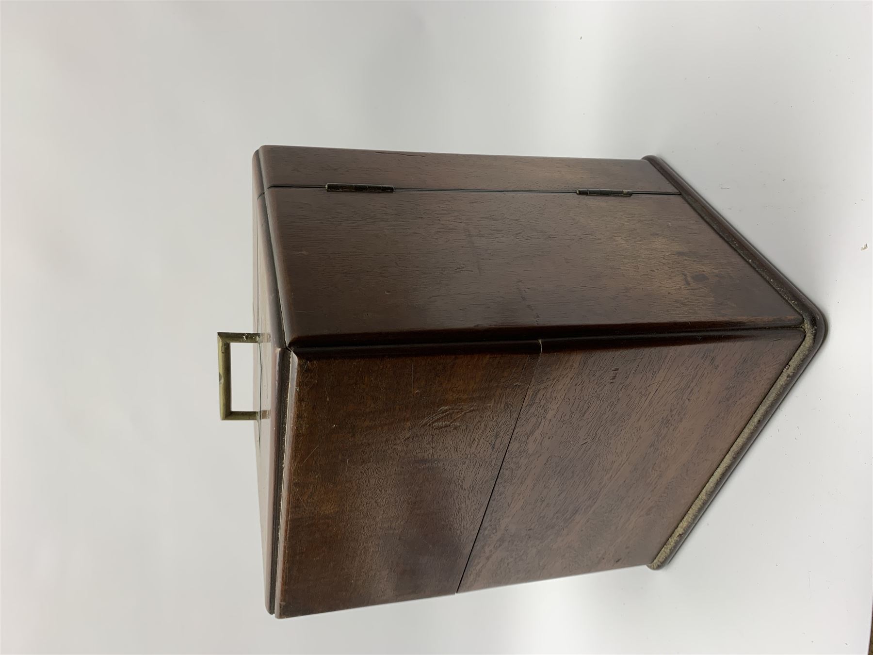 19th century mahogany travelling apothecary cabinet, with recessed brass carry handle to top, and two deep-section hinged doors to the front opening to reveal a fitted interior with clear glass bottles and two drawers, H27cm