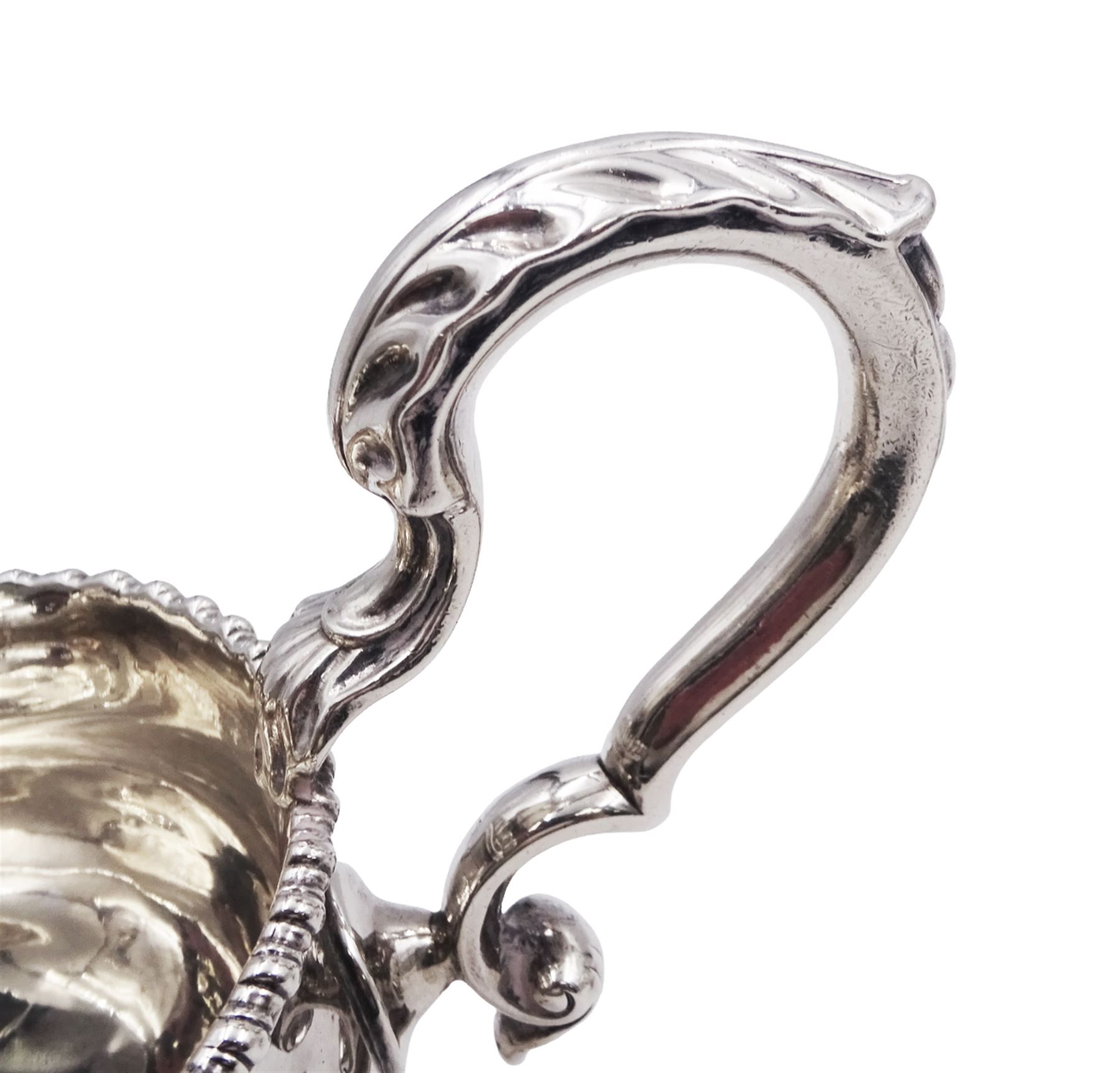 Pair of George III silver sauce boats, each of typical form with gadrooned rim, and acanthus capped scroll handle, upon three shell mounted shell pad feet, hallmarked George Methuen, London 1760 including handle H13cm, approximate total weight 30.25 ozt (941 grams)