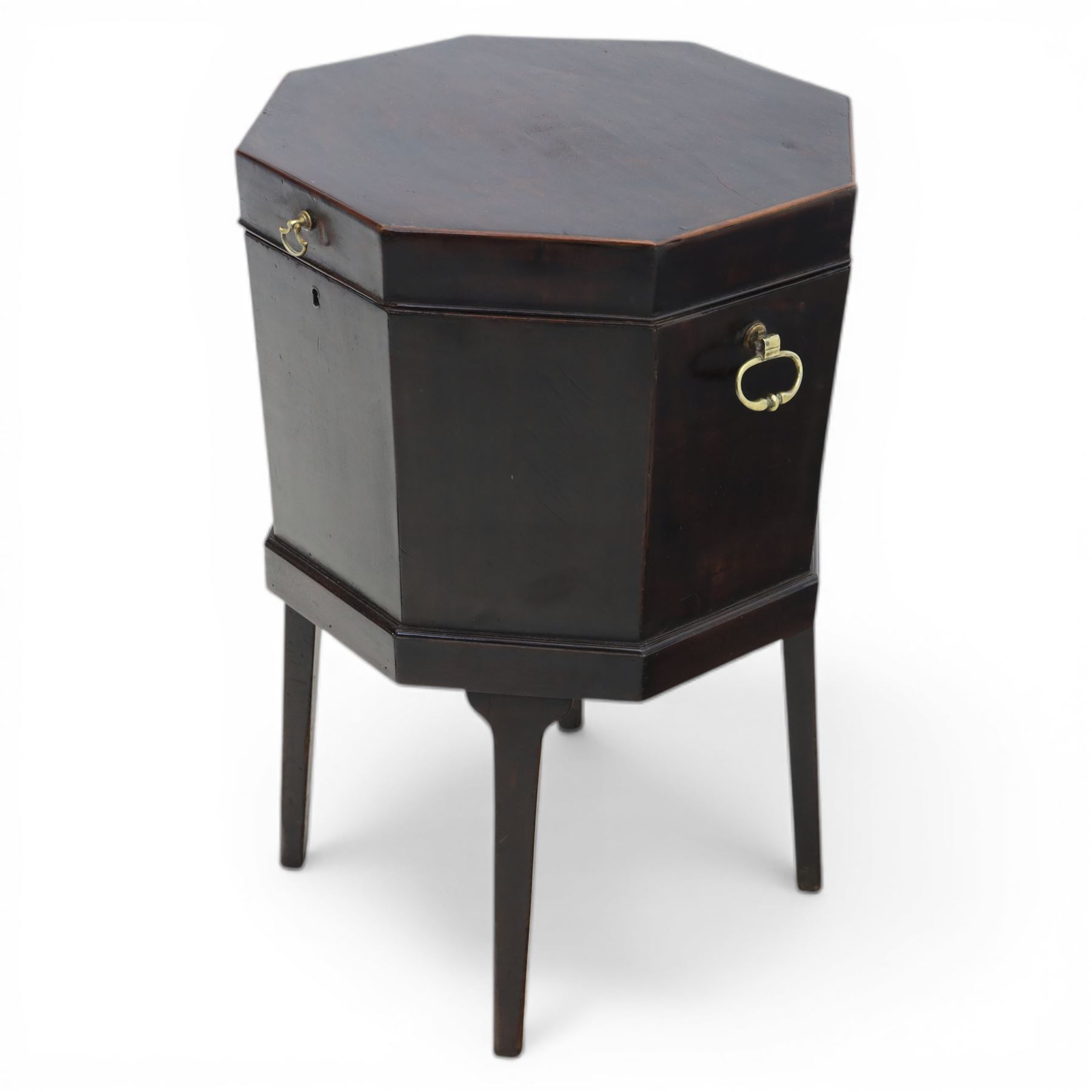 George III mahogany cellarette, of octagonal form with hinged top, brass handles and hinges, raised upon tapering supports