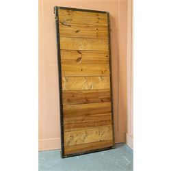 Edwardian giltwood and composition framed upright wall mirror, having a floral boss to each corner united by flowerhead decoration, enclosing an original distressed mirror plate. 193cm x 77cm.  - COLLECTION BY APPOINTMENT FROM: The White House, Thirsk Road, Easingwold, York, YO61 3NF - CALL 01723 507111 TO ARRANGE