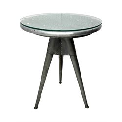 Contemporary industrial design riveted metal table, by repute fashioned from salvaged aeroplane parts, with a circular glass top on a tripod base, accompanied by three adjustable stools upholstered in burgundy