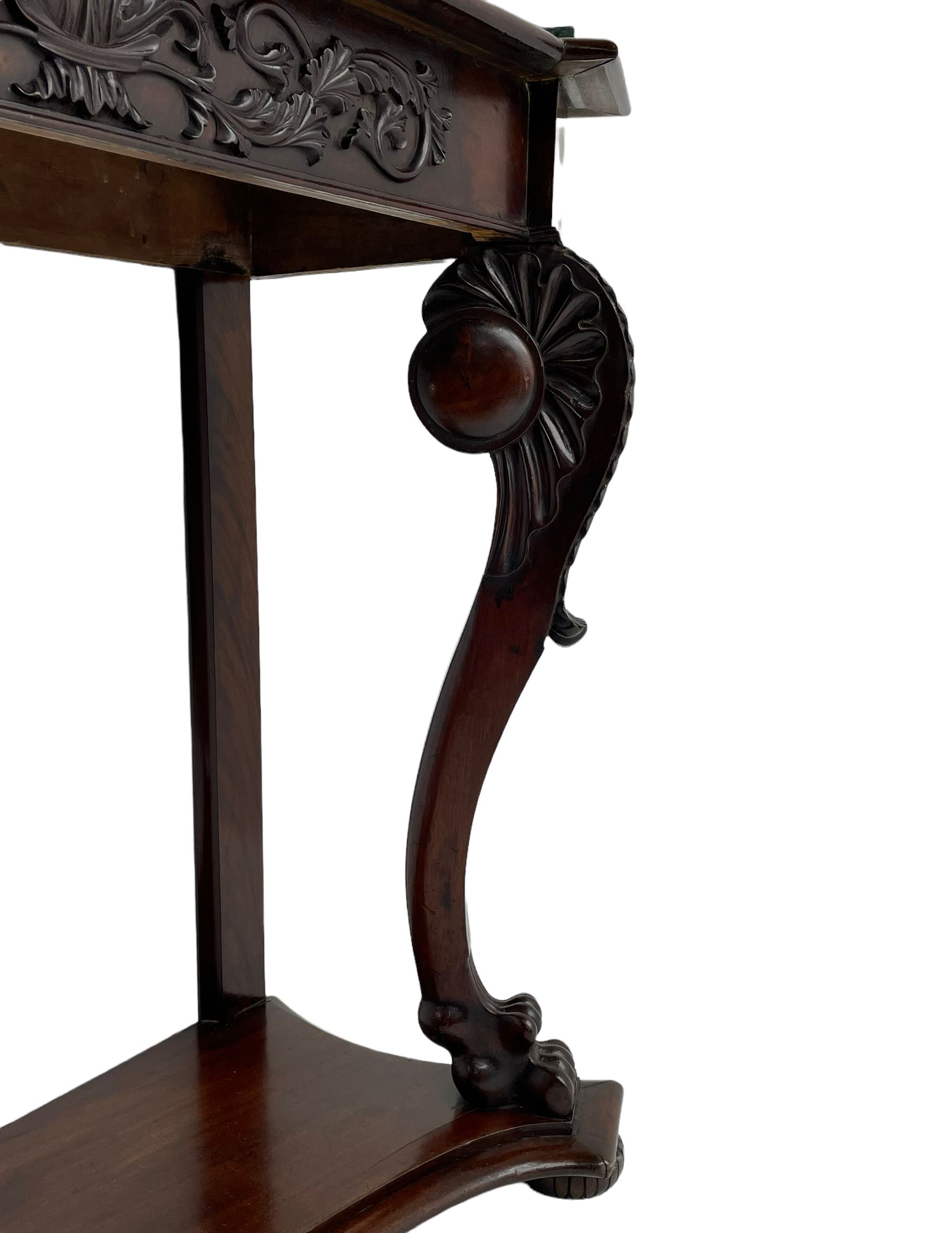 19th century Irish mahogany console table, with green canted marble top and figured frieze with carved scrolled foliage mount, acanthus carved cabriole supports with claw feet and shaped moulded plinth
