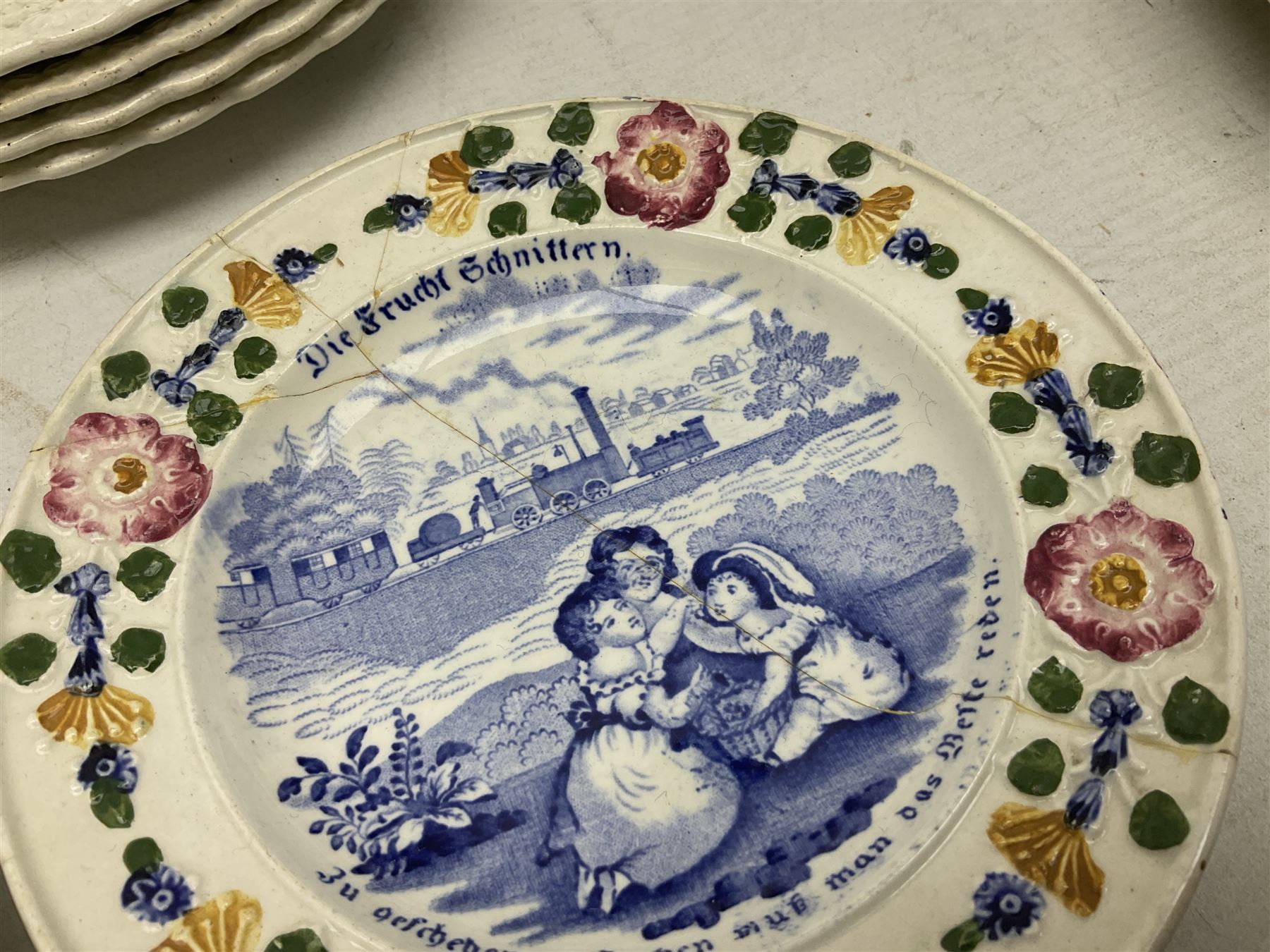 Collection of 19th century William Smith & Co nursery plates, to include examples decorated in the pastime series, and similar, all with moulded floral borders