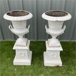 Pair of Victorian cast iron white painted urns on plinths - THIS LOT IS TO BE COLLECTED BY APPOINTMENT FROM DUGGLEBY STORAGE, GREAT HILL, EASTFIELD, SCARBOROUGH, YO11 3TX