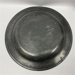 Group of seven 19th century pewter chargers, each of circular form with dished centre, two examples with touch marks verso, each approximately D39cm