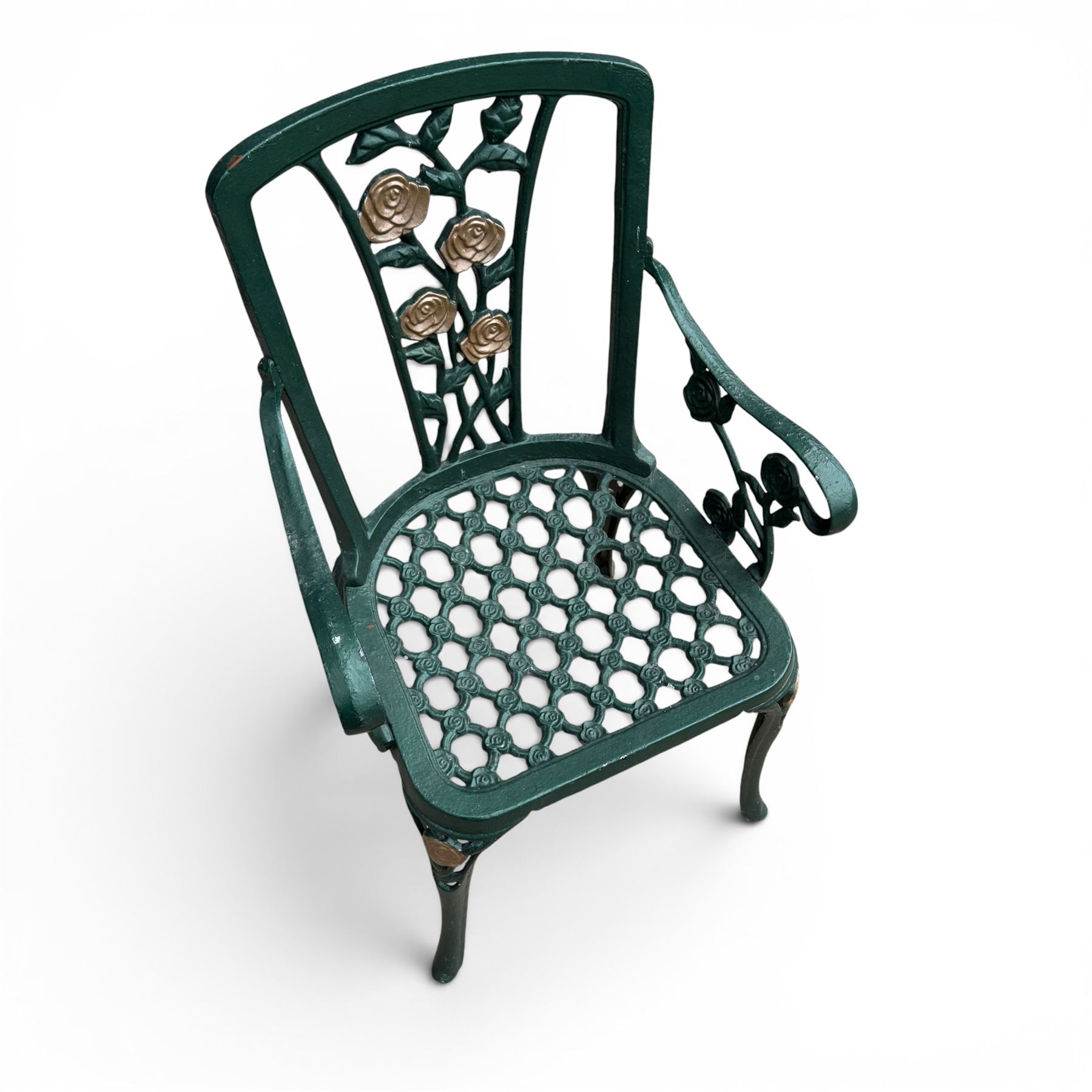 Cast aluminium oval garden table and set of four armchairs with pierced rose design back splats