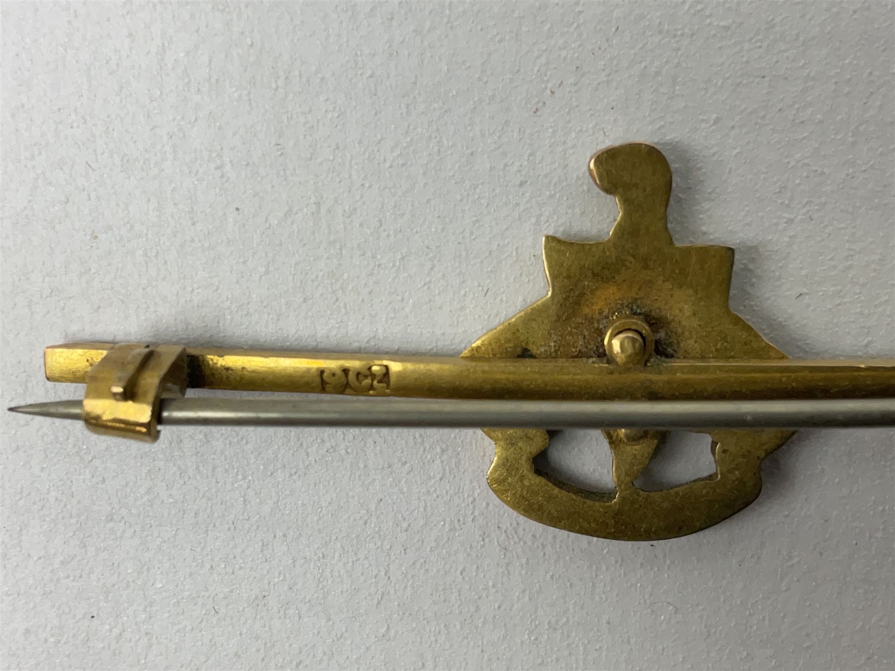 Royal Sussex Regiment 9ct gold sweetheart brooch with Regimental Association membership card to 6406670 Pte. Brock dated 1940; an 18ct gold pin badge enamelled with a shipping company (?) pennant; and an ARP button-hole badge (4)