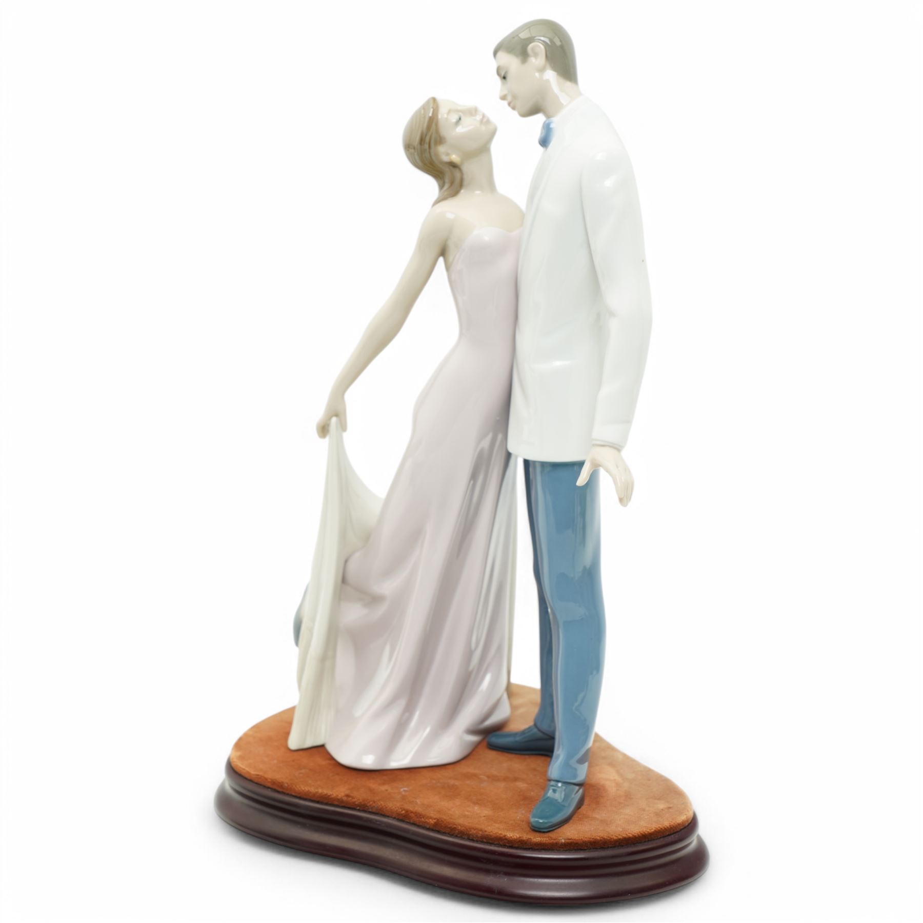 Two Lladro figures, comprising First Melodies 6475 and Happy Anniversary 8292, with one Nadal ballerina, all boxed, tallest H31cm excluding base (3)