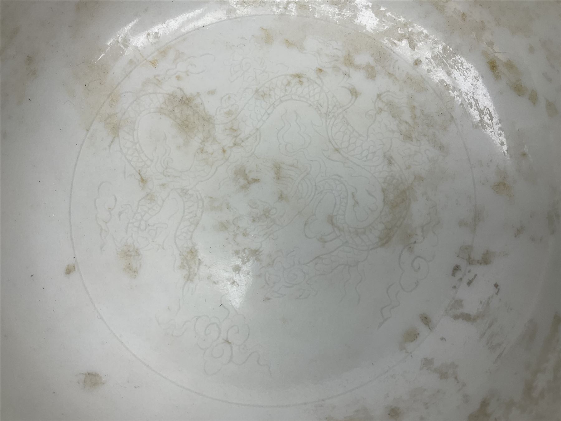 Pair of Chinese famille jaune bowls, decorated in green enamel with a dragon chasing a flaming pearl amongst clouds, upon a yellow ground, the interior decorated to centre with dragon, with six character mark beneath, D17.5cm