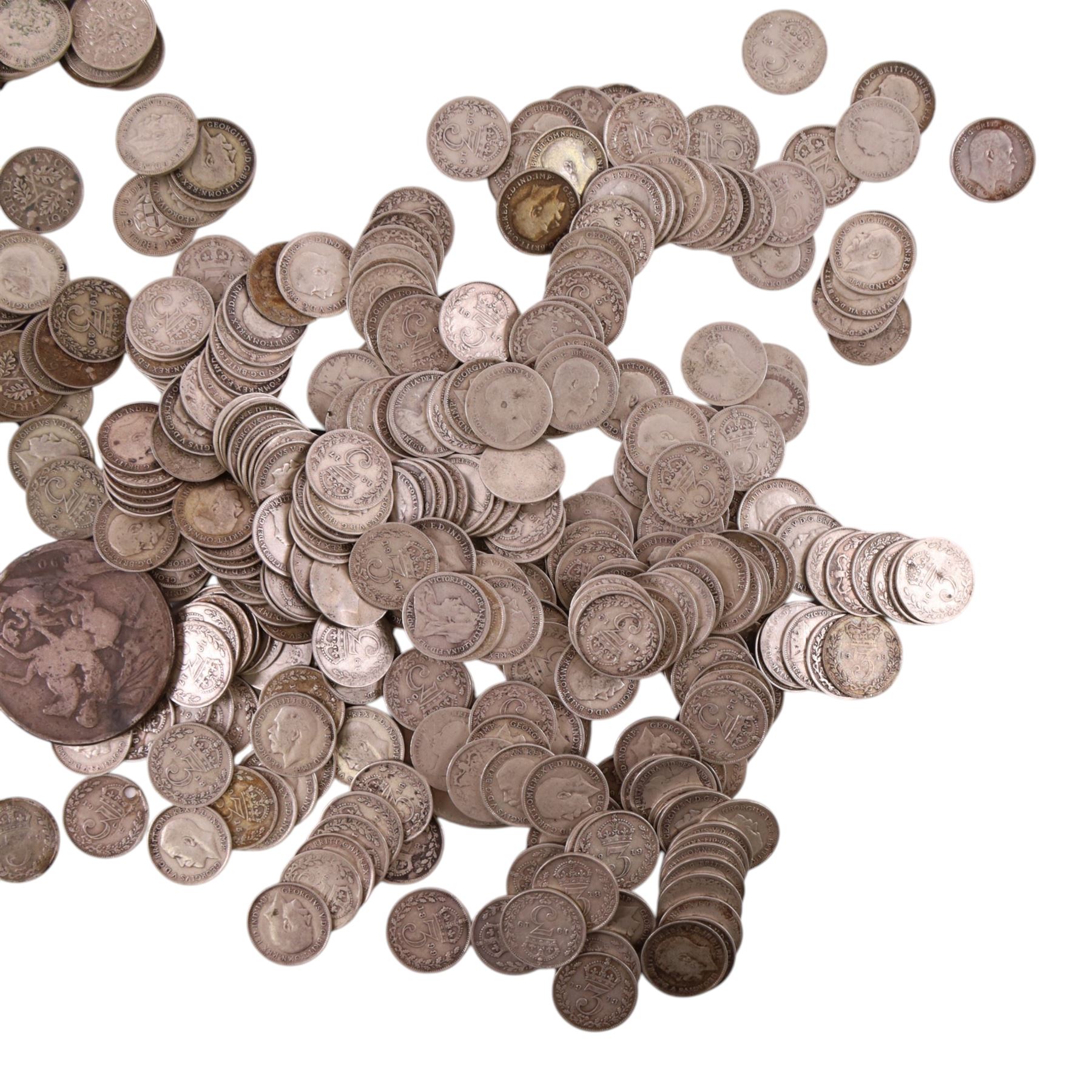 Approximately 418 grams of Great British pre-1920 and approximately 300 grams of Great British pre-1947 silver threepence coins, together with a Queen Victoria 1890 silver one crown coin and a Queen Elizabeth II 1965 'Churchill' one crown coin