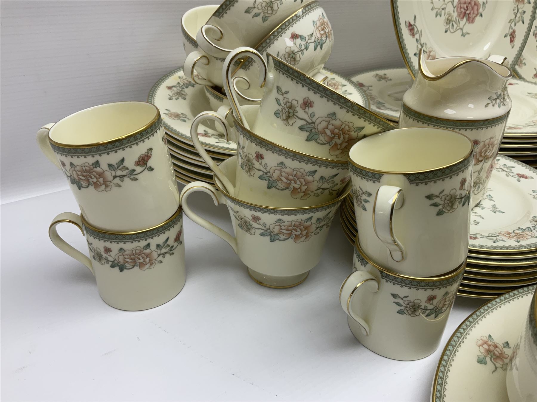 Minton Jasmine pattern tea and dinner wares, including dinner plates, sauce boats, side plates, bowls, teacups, coffee cans and twin handled soup bowls, etc (122)