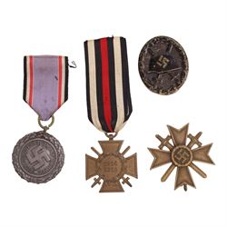 WWI German Hindenburg cross, together WWII bronze Merit Cross with crossed swords, Luftschutz Civil Defence medal and German Wound Badge 
