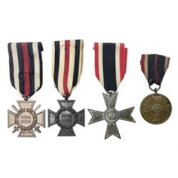 Two WW1 German medals - copy Cross of Honour with swords (combatants); Cross of Honour without swords (non-combatants); and two WW2 German medals - War Merit Medal; and War Merit Cross; all with ribbons (4)