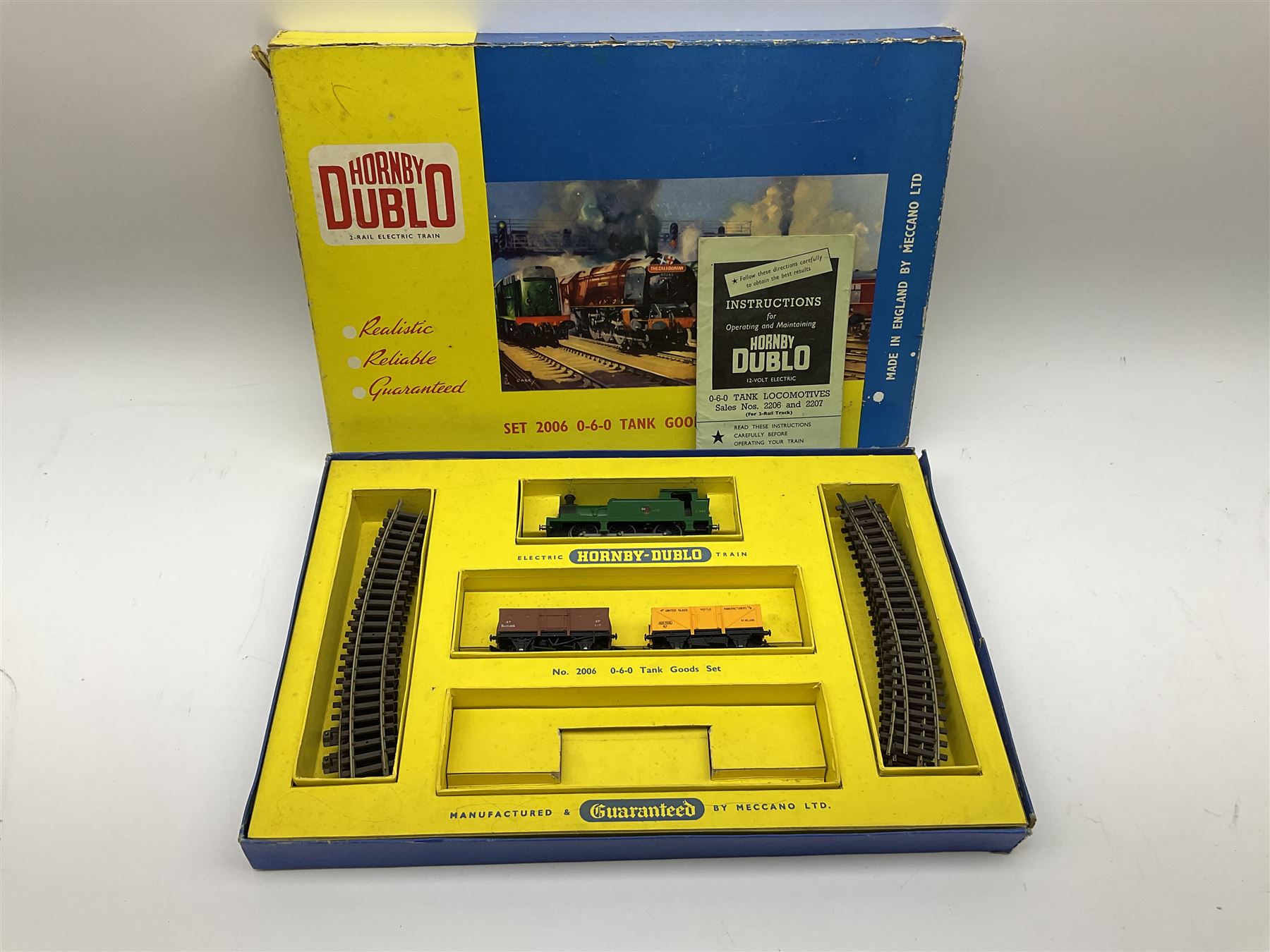 Hornby Dublo - two-rail set 2021 'The Red Dragon ' passenger train W.R. with Castle Class 4-6-0 locomotive 'Cardiff Castle' No.4075 and two coaches (no track), boxed with paperwork, Red Dragon headboard and oil tube; and two-rail set 2006 Tank Goods Train set with Class R1 0-6-0 tank locomotive No.31340 and two open wagons (lacking guards van) and track, boxed with instructions (2)