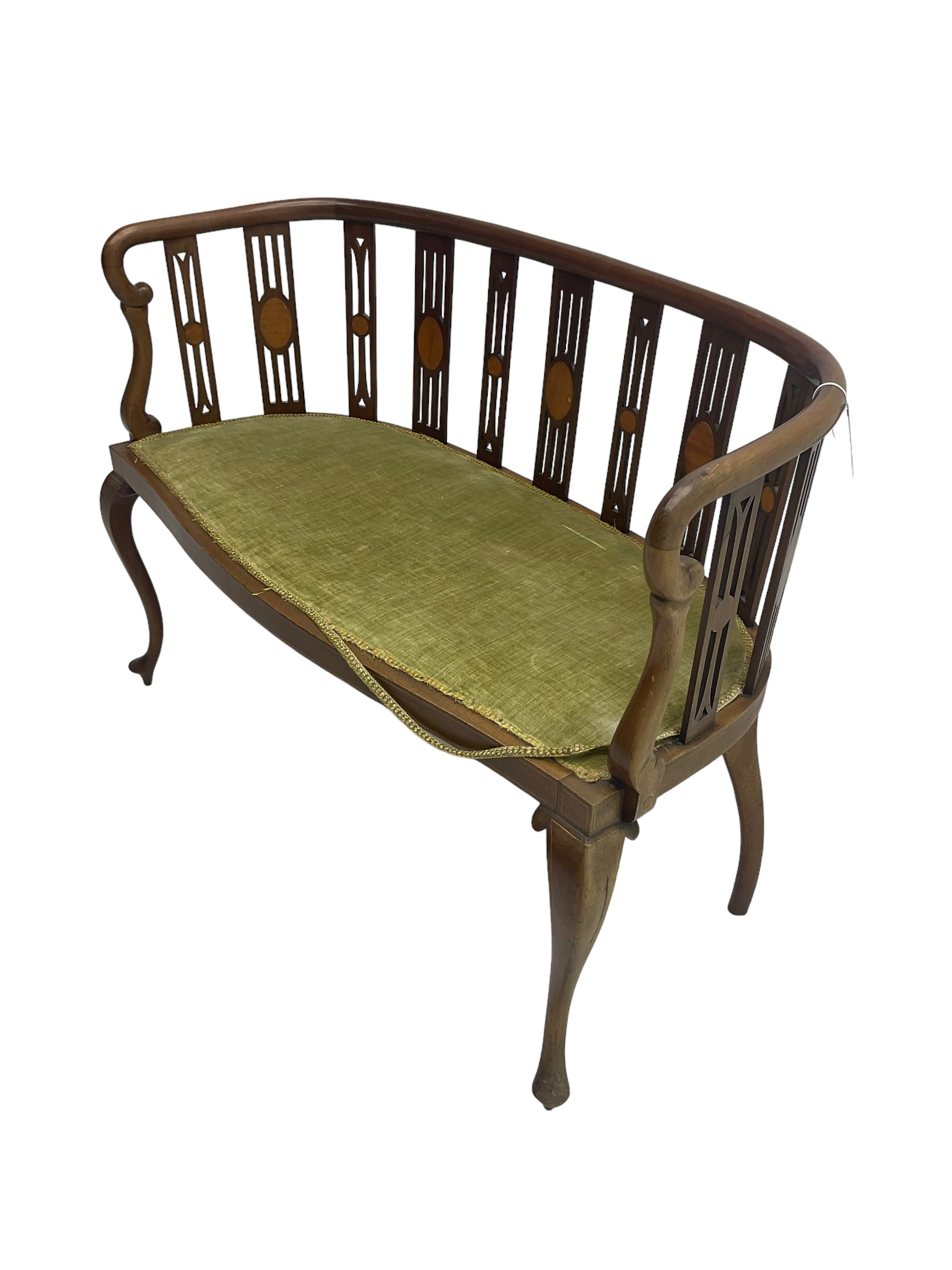Edwardian inlaid mahogany salon settee or bench, the pierced and inlaid splat back over serpentine front, seat upholstered in laurel green velvet, raised on cabriole supports with satinwood stringing