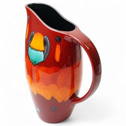 Four Poole pottery 'Volcano' pattern items comprising charger D40cm, pitcher H31cm, ginger jar and cover and salt pot (4)