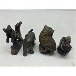 Eight netsuke, modelled as a rabbit, rat, elephant, rhino, dog, owl, penguin and horse