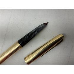 9ct gold propelling pencil with engine turned decoration and vacant cartouche, by S J Rose & Son, stamped 375, L12cm, together with a Parker 12ct rolled gold fountain pen, and two rose gold engine turned propelling pencils to include a rose gold example