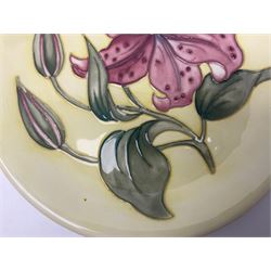 Moorcroft Tiger Lily pattern plate on a yellow ground, with painted and impressed mark beneath, D26cm