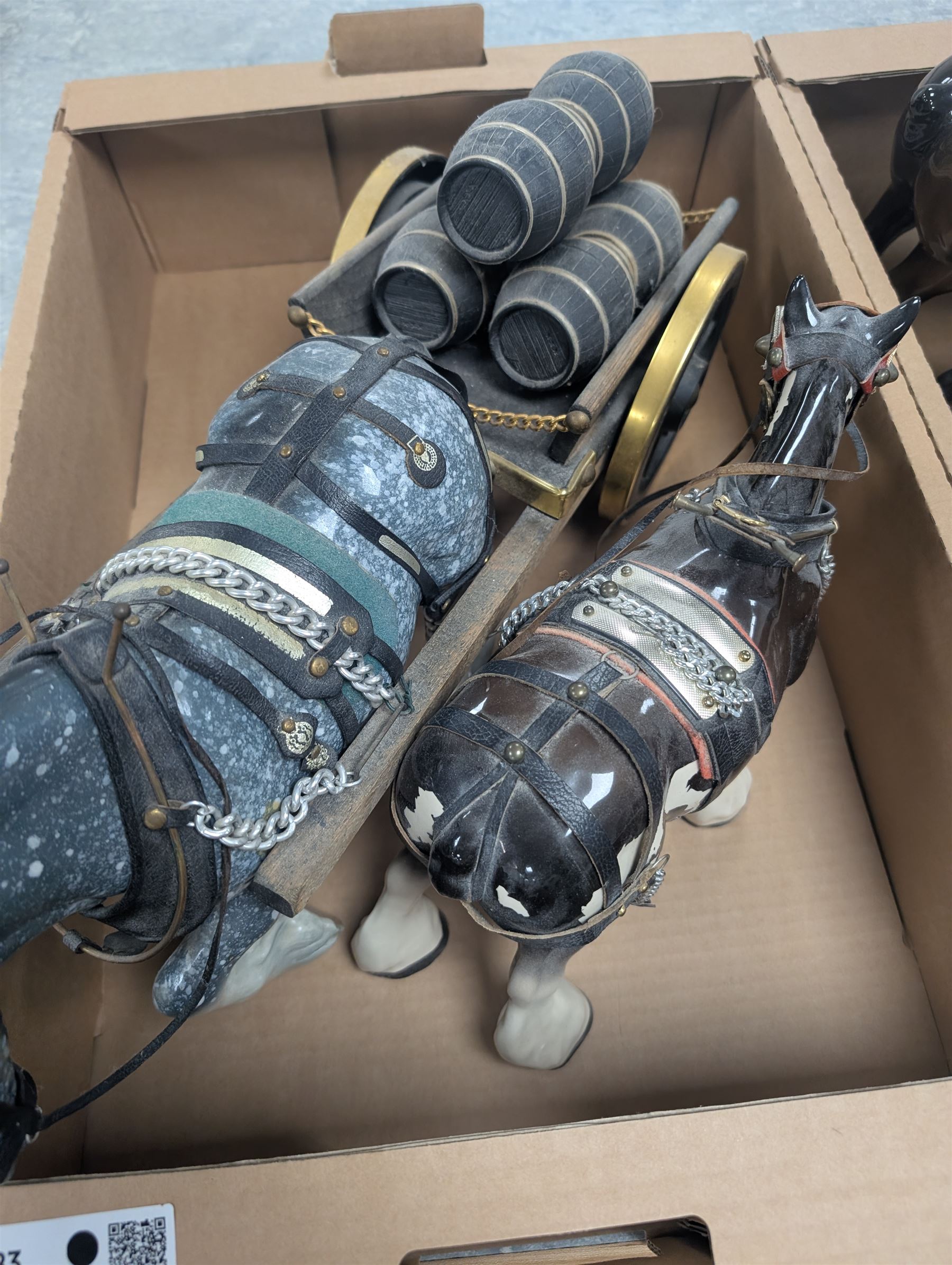 Collection of Shire horses, including Beswick and Sylvac examples, one with wooden cart and one with caravan, together with a Beswick donkey figure