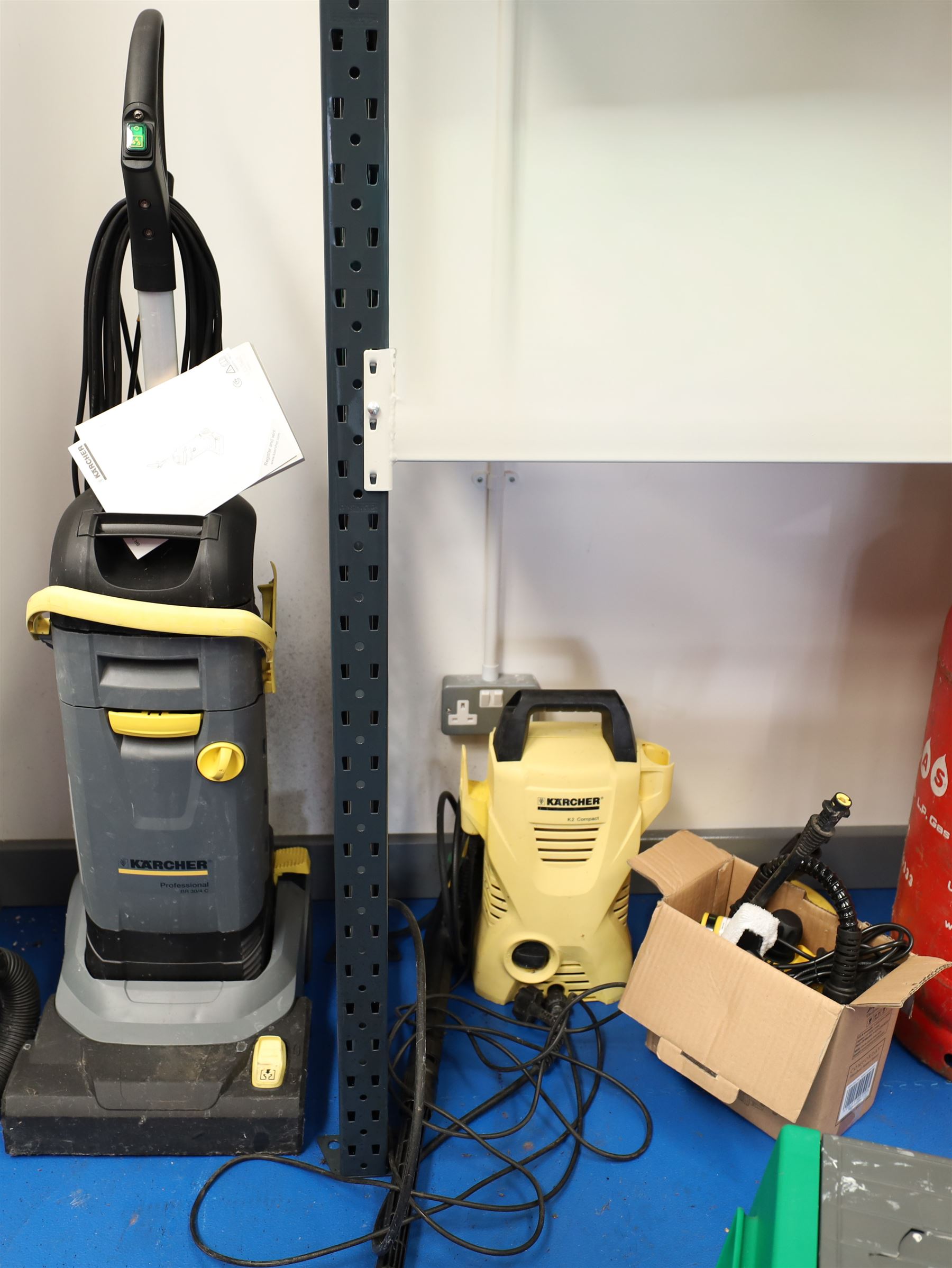 Karcher professional BR 30/4 C upright scrubber dryer floor cleaner; and a Karcher K2 compact pressure washer 