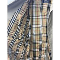 Ladies Burberry double breasted trench coat, with belt and detachable woollen gilet, in traditional cream colour with Burberry check lining, together with a gentlemans Burberry single breasted trench coat, both L112cm
