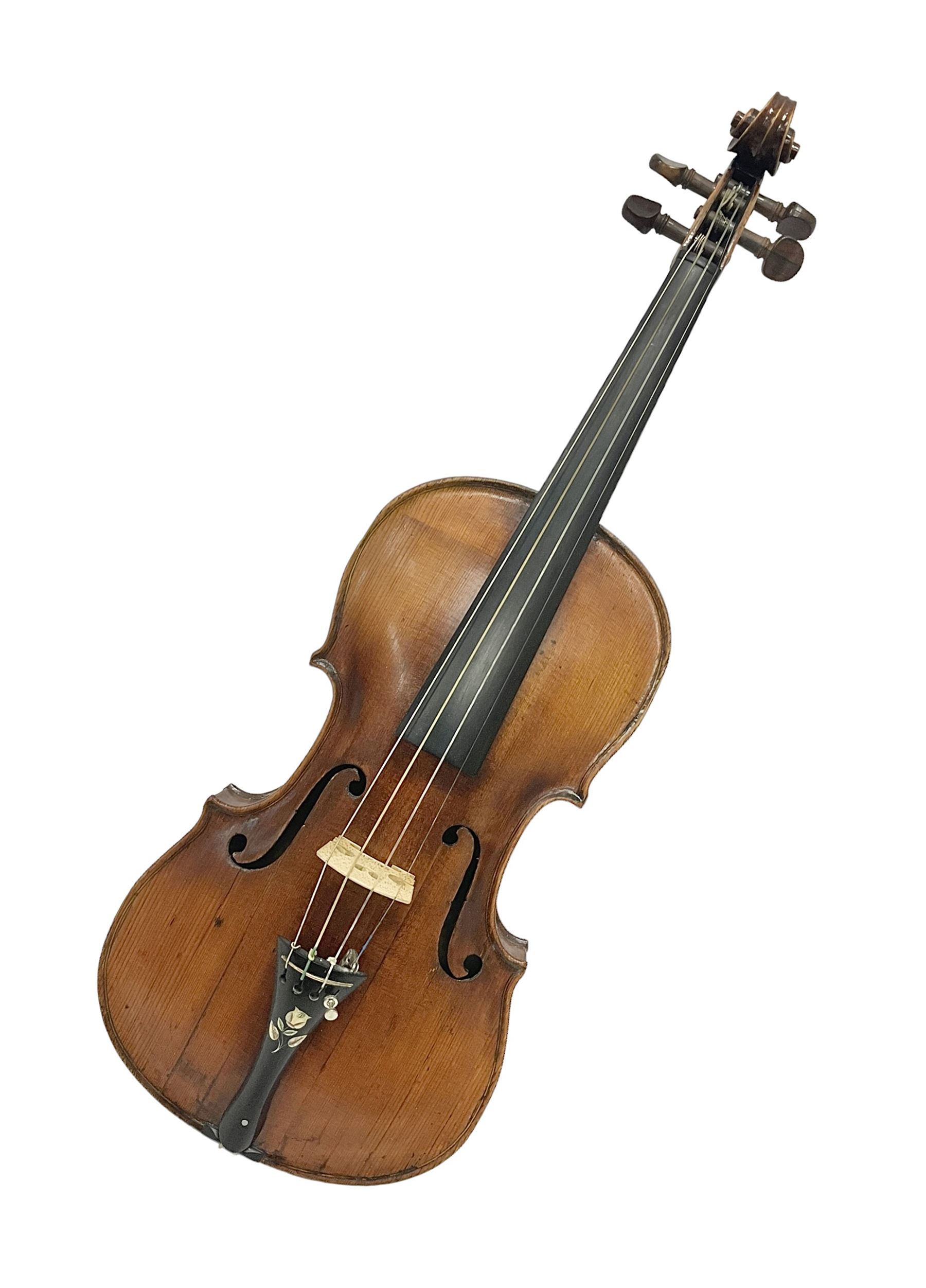 19th century full sized violin in a later hard case, decorative mother of pearl inlay to the tail piece Overall length 60cm No bow