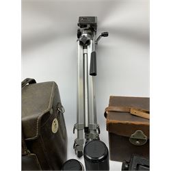 Ensign Focal Plane Roll Film Reflex camera in a brown leather carrying case with purple lining, together with a Canon T70, a leather camera case, and tripod.  