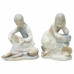A group of eight Nao figures, together with one Lladro Polar Bear figure, each with printed mark beneath (9)