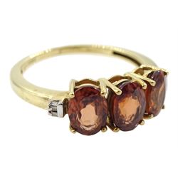 9ct gold three stone oval cognac zircon and baguette chip diamond ring, hallmarked
